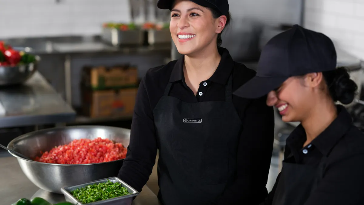 Chipotle workers prepare food