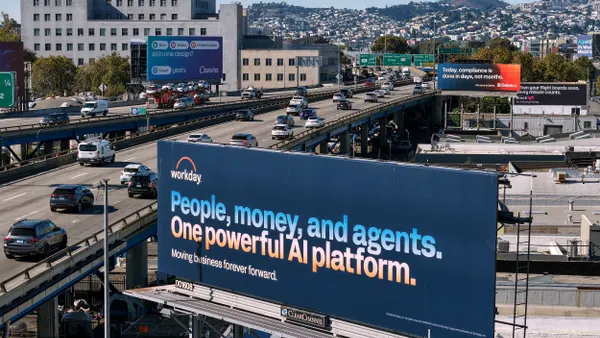 A Workday billboard says "People, money and agents. One powerful AI platform. Moving business forever forward."