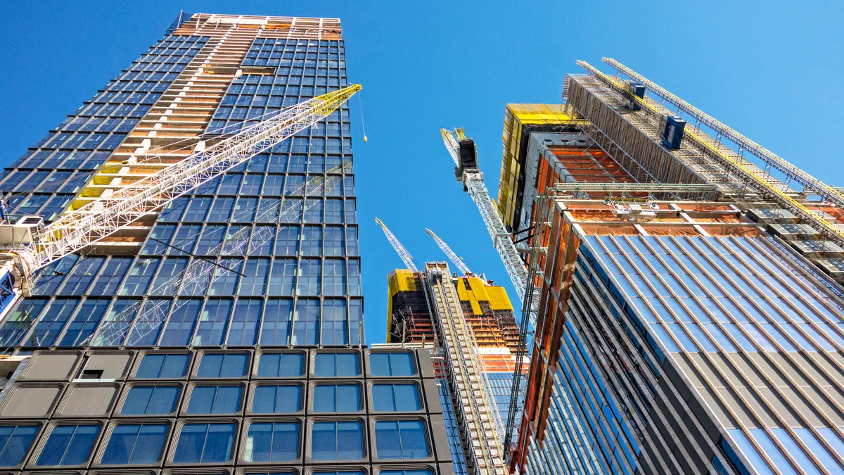 A large skyscraper under construction in an urban area