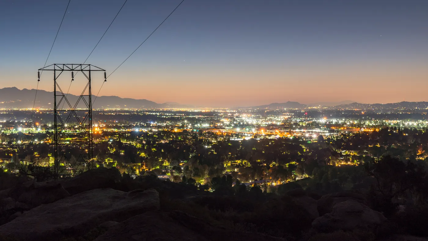 Los Angeles predawn mountain view of power lines entering the San Fernando Valley. The San Gabriel Mountains are in background.