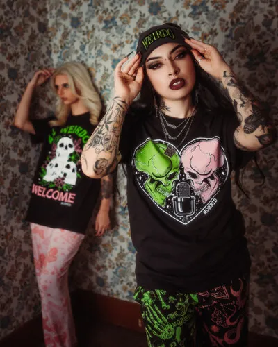 Two models wearing pieces from the Spencers x Morbid collection