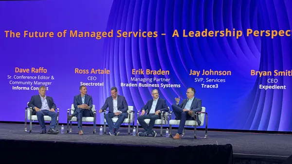 Five executives seated on stage during a panel discussion at the Channel Partners Conference and Expo in Las Vegas in April 2026