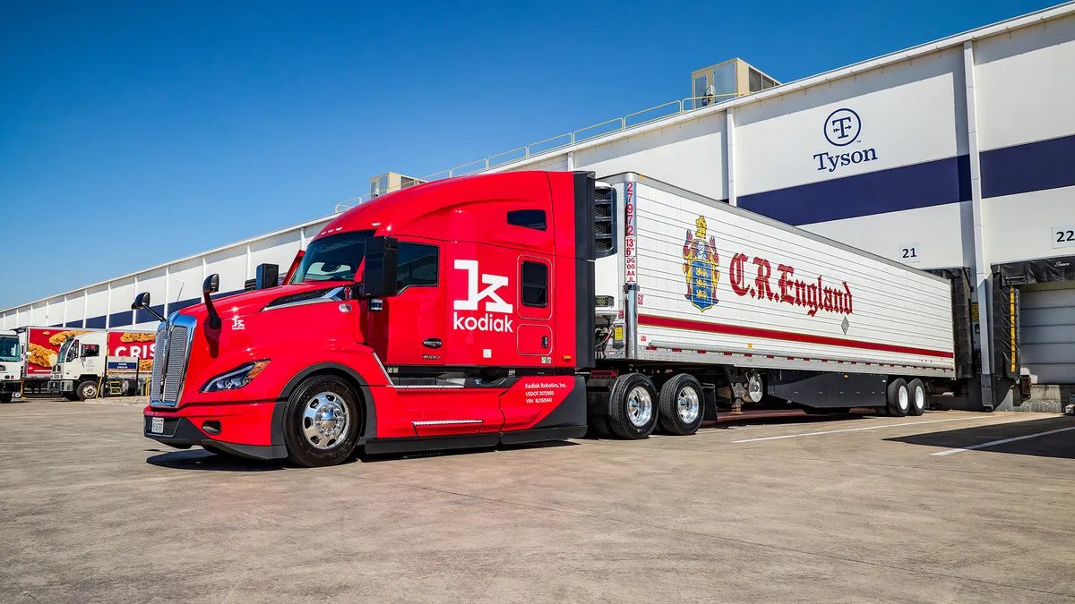 A Kodiak Robotics truck is attached to a C.R. England trailer.