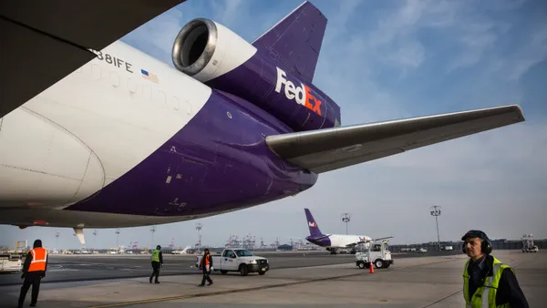 Workers prepare to offload an incoming FedEx plane at a FedEx global hub, one of only seven in the U.S., on December 16, 2014 in Newark, New Jersey.