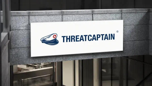 A sign on the front of an office builidng reads ThreatCaptain.