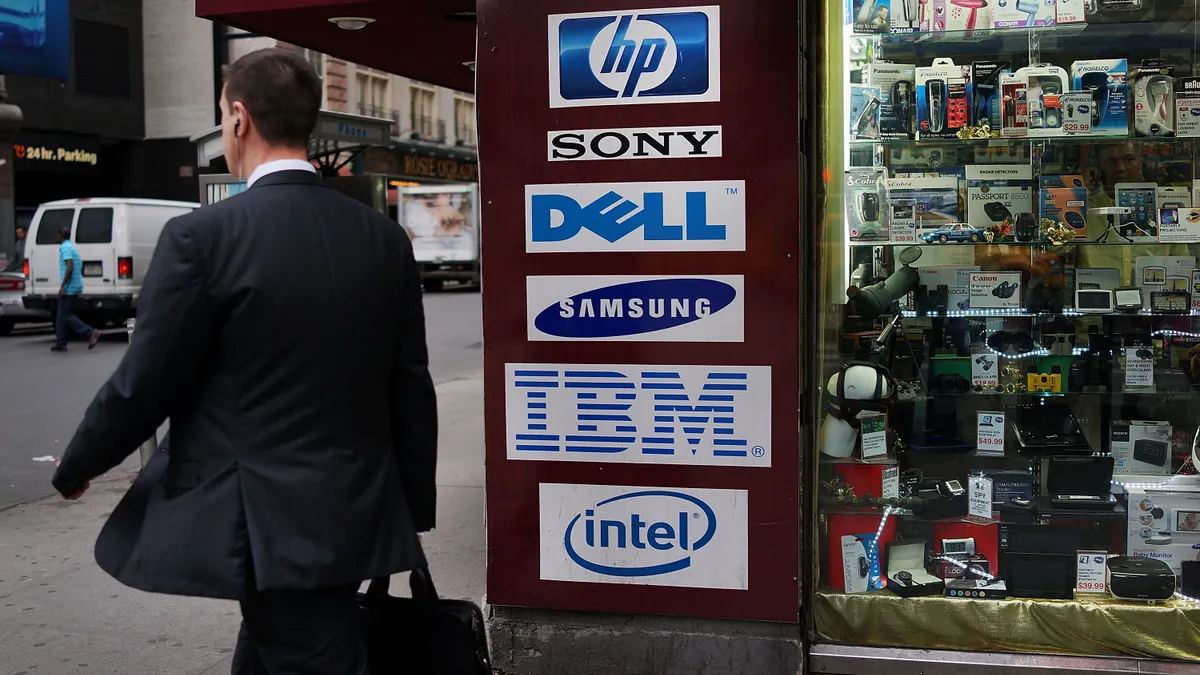 A store advertises the names of personal computer makers (PC's) in Times Square on April 11, 2013 in New York City.