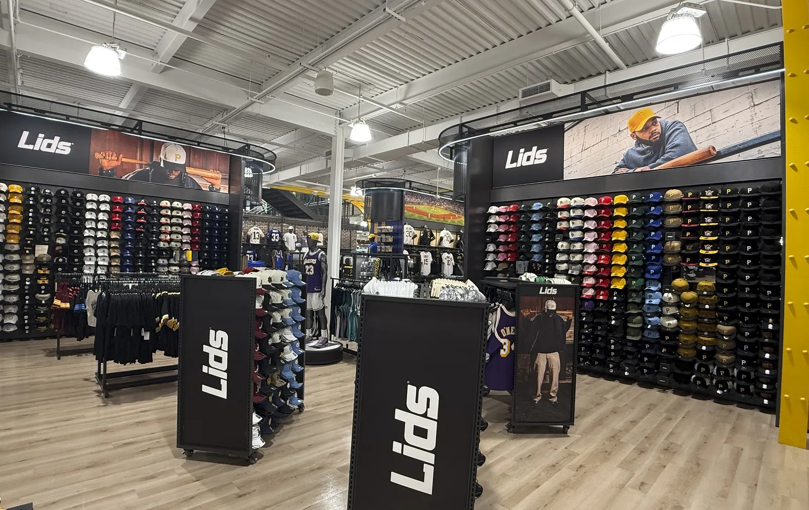 A display of Lids hats in a Dick's Sporting Goods store.