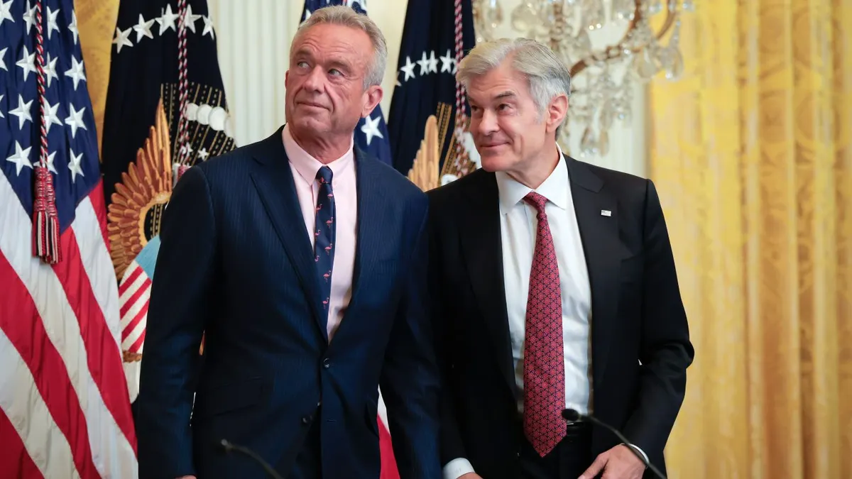 HHS Secretary Robert F. Kennedy Jr. and CMS Administrator Dr. Mehmet Oz confer before an event on health technology in the East Room of the White House on July 30, 2025, in Washington, DC.