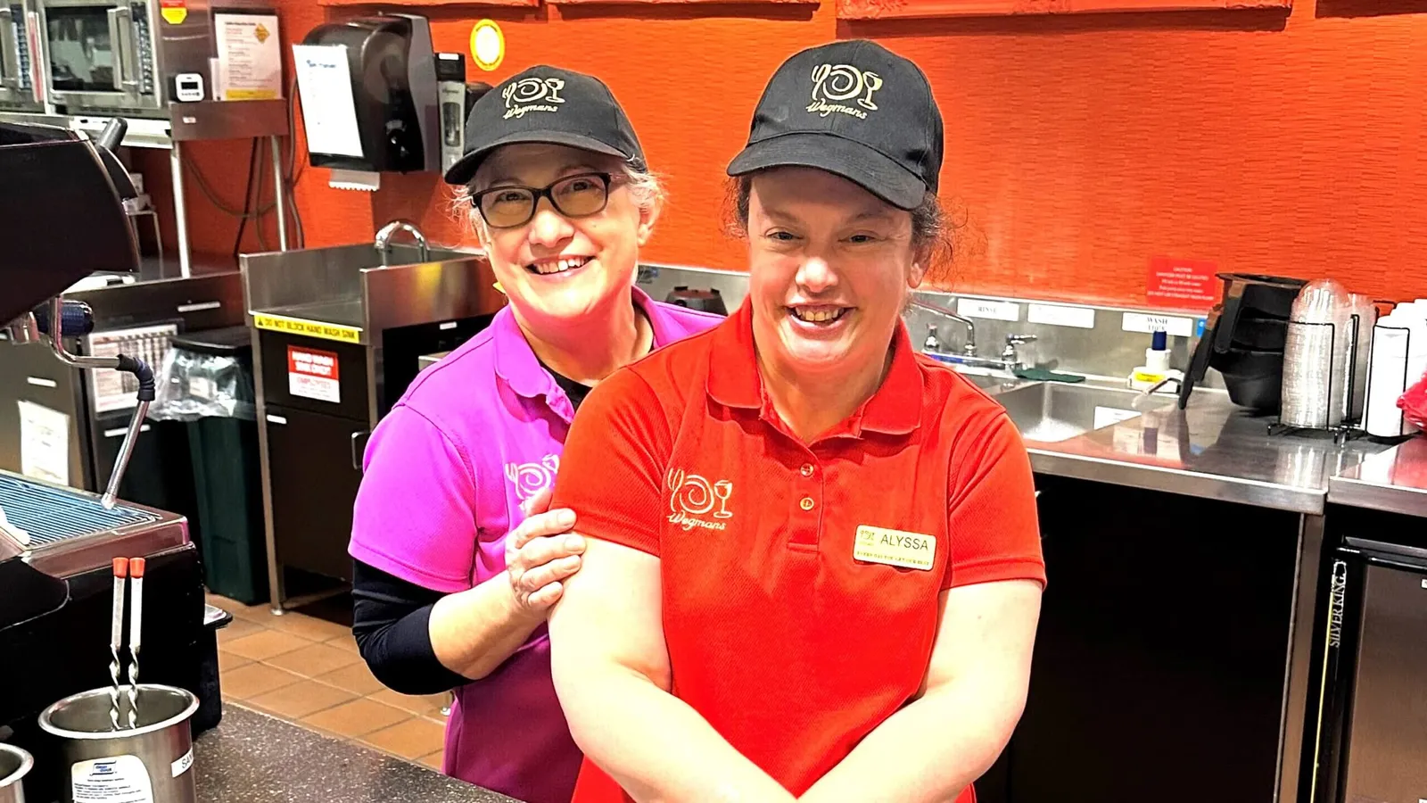 Two workers at a grocery store.