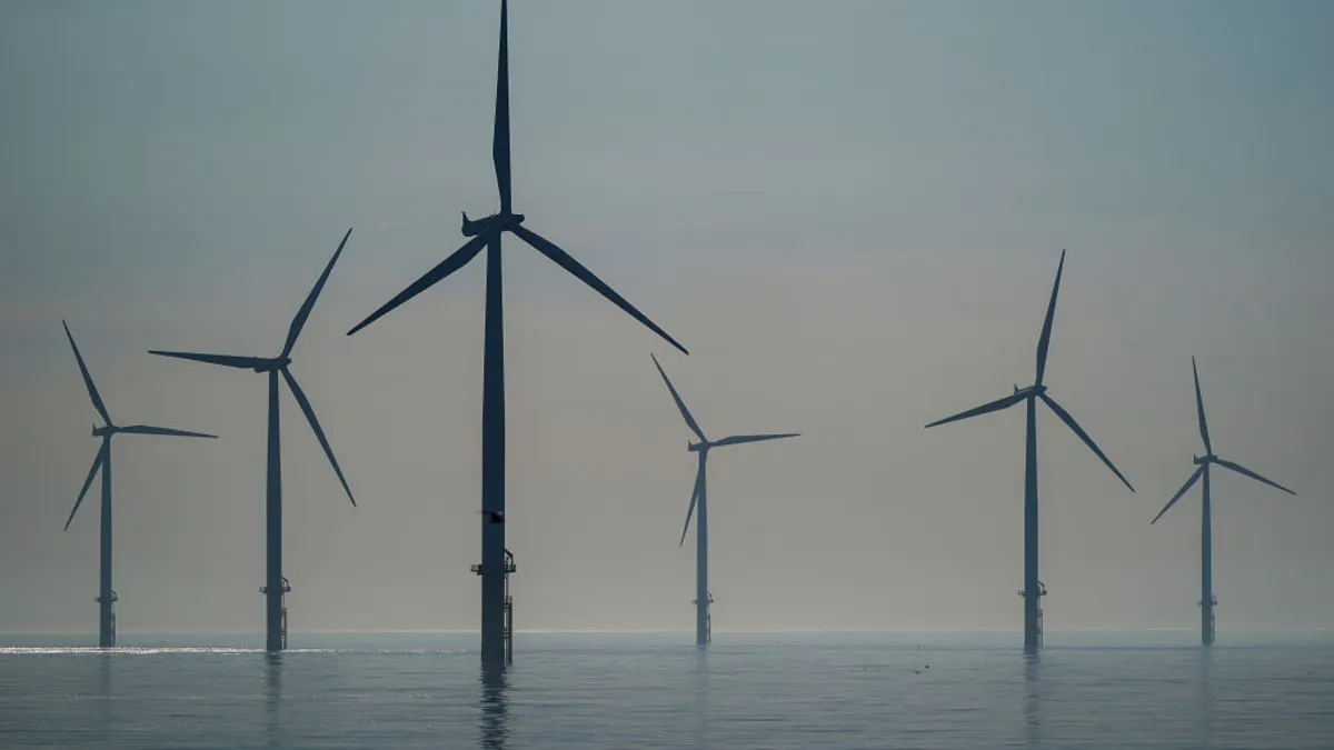 The sun rises over the EDF energy offshore windfarm on July 19, 2024 in Redcar, England.