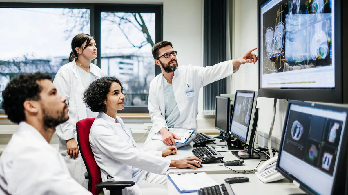 Team Of Doctors Looking At Lab Results