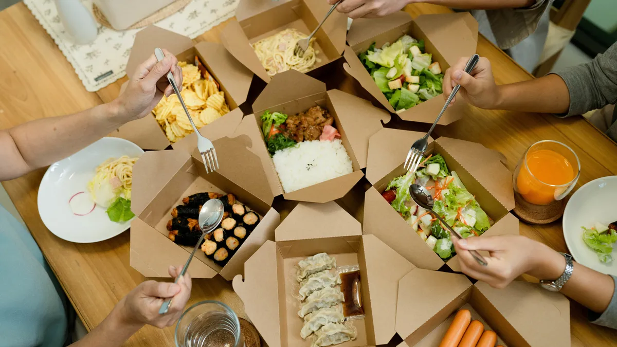 takeout boxes with restaurant food