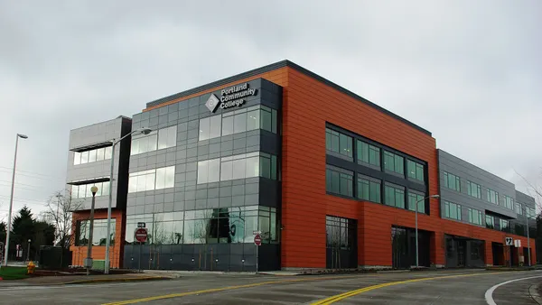 Orange and gray building with Portland Community College sign in corner.