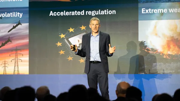 A technology business analyst presents a keynote at a technology partners conference.