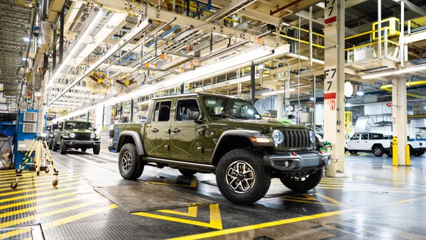 A green 2024 Jeep Gladiator comes off the final assembly line at Stellantis' Toledo Assembly Complex.