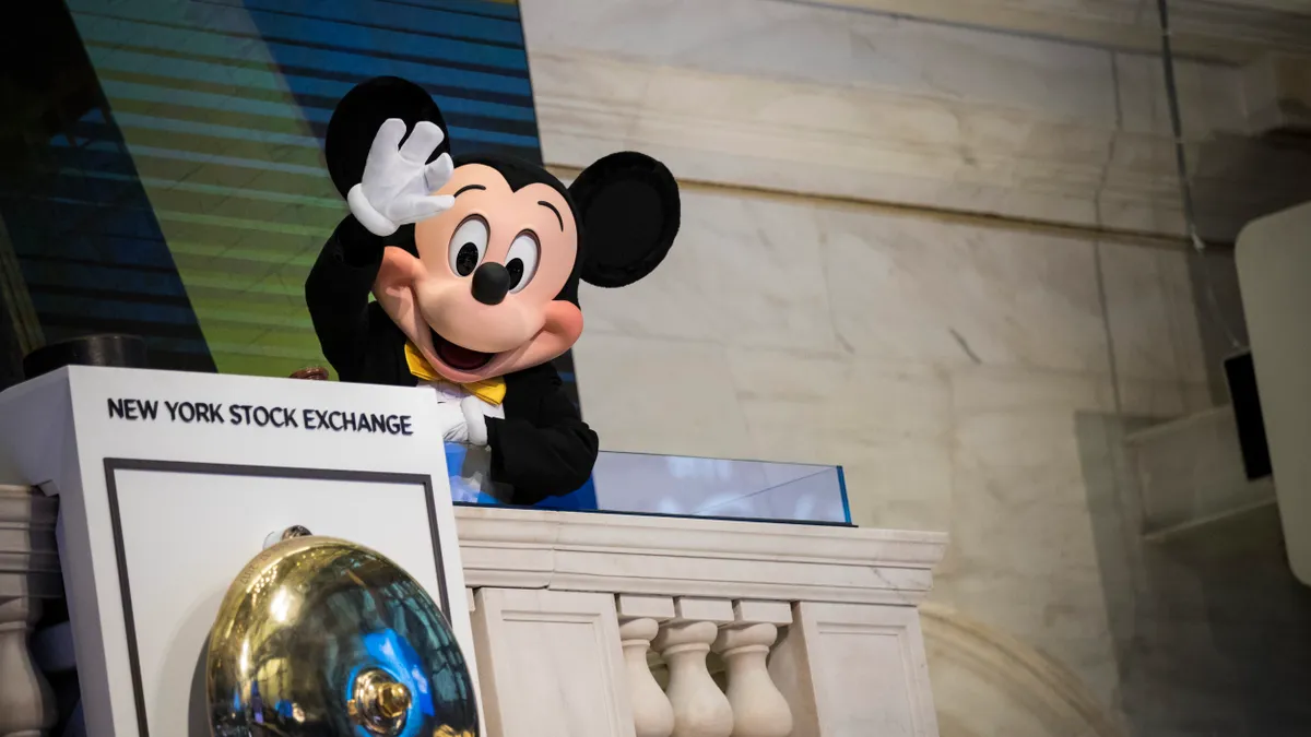 Mickey Mouse waves before ringing the opening bell at the New York Stock Exchange