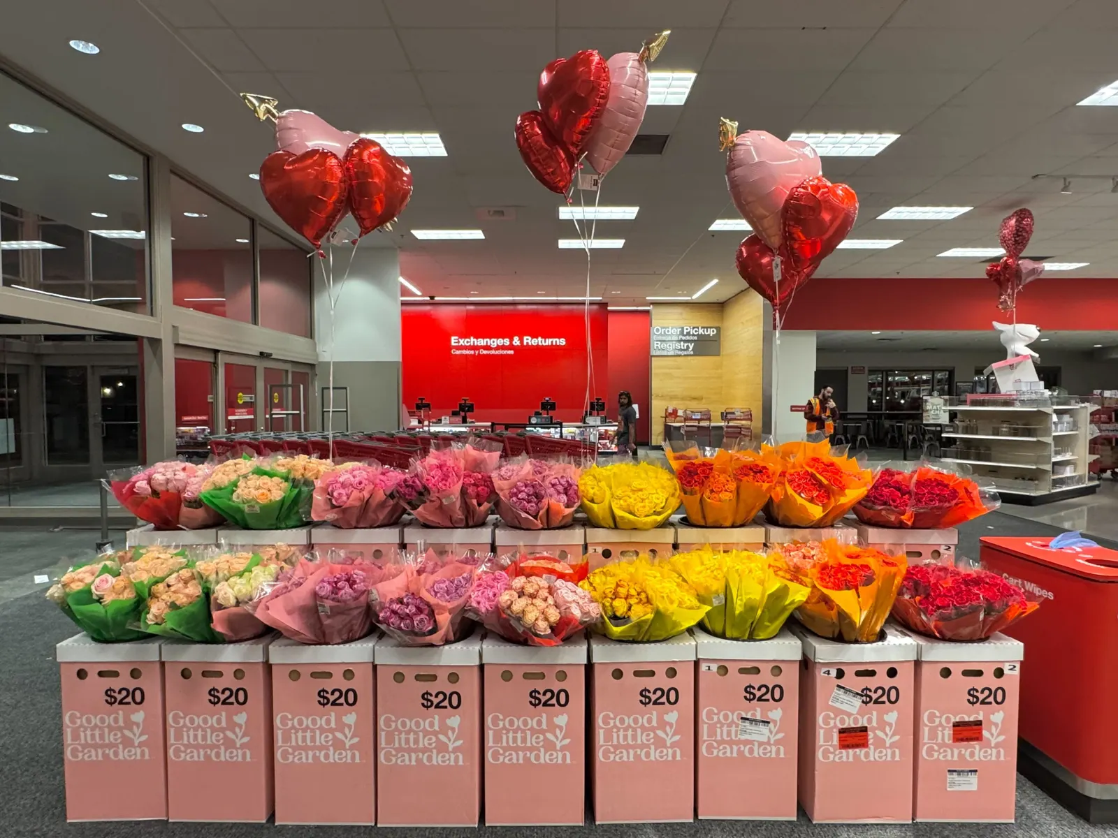 Rows of pink, red and yellow flowers inside a Target store