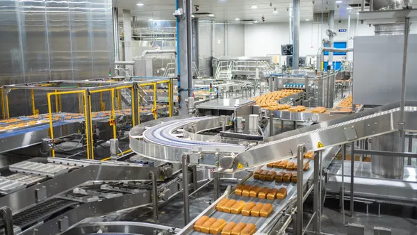 A photo of food items on an automated production line.