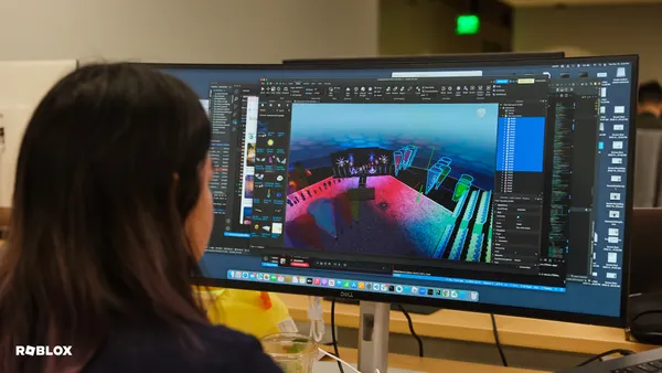 A Roblox developer uses a computer
