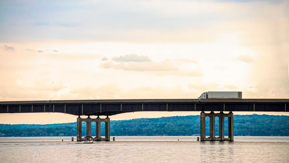 A tractor-trailer crosses a bridge over Chautauqua Lake in New York state.