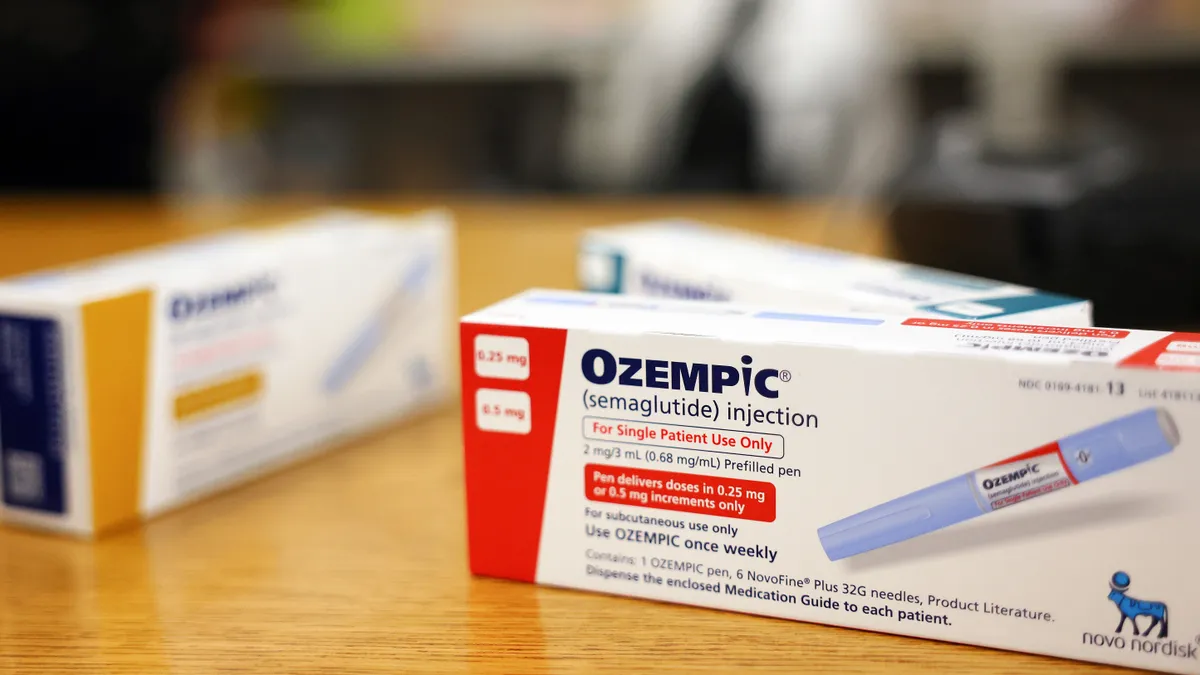 Boxes of the diabetes drug Ozempic rest on a pharmacy counter.