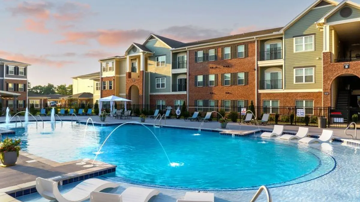 Three-level garden apartments surrounding a pool.