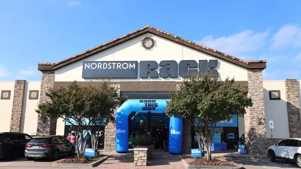 A store entrance on a sunny day.