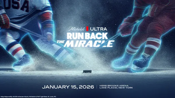 A hologram of two hockey players going for a puck with Michelob Ultra branding in the center.