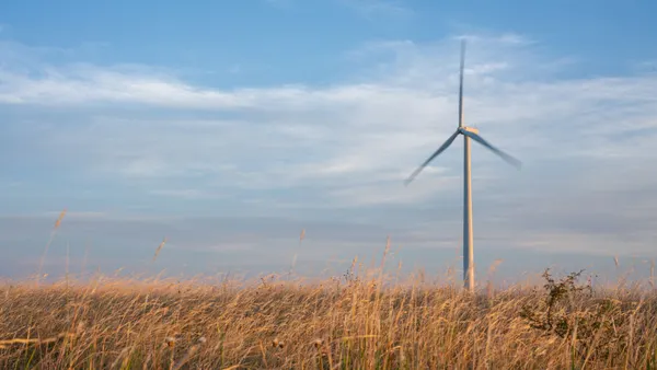 A wind turbine in a field at dawn on June 28, 2024 in Nolan, Texas.