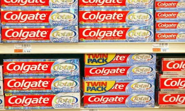 Packages of Colgate toothpaste are displayed on a shelf at a drug store February 3, 2004 in Chicago, Illinois.