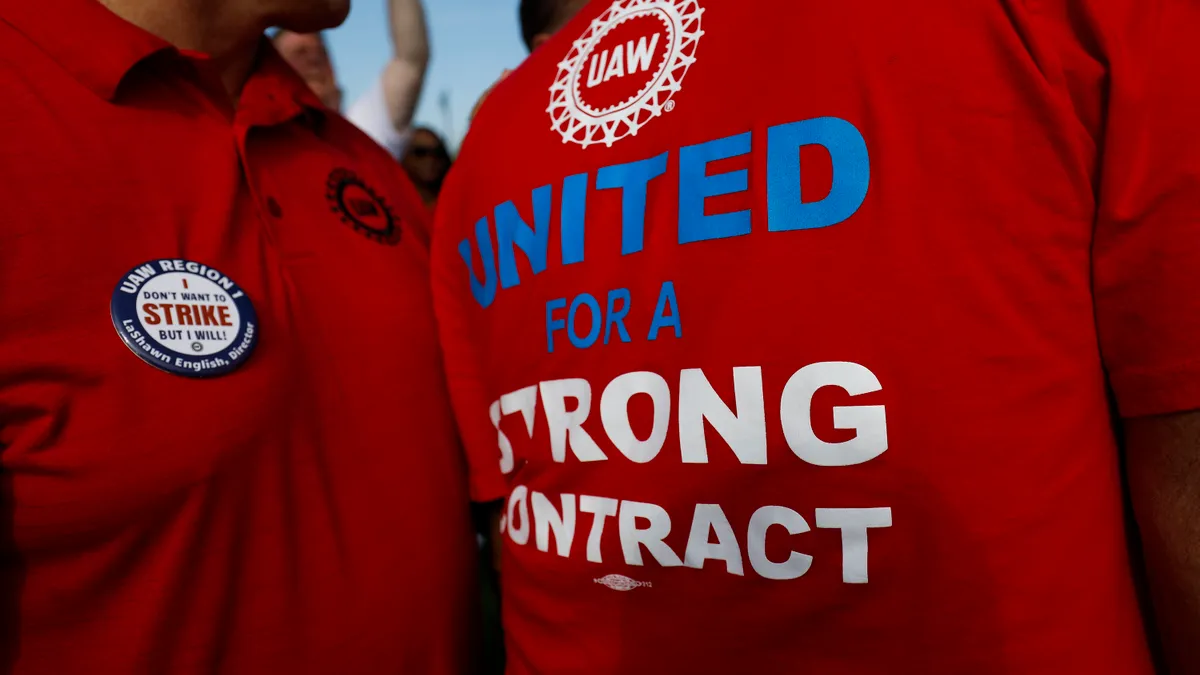 UAW members talking after a rally in Detroit