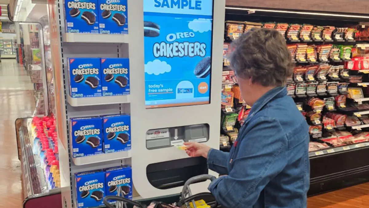 A Wakefern shopper uses a Freeosk terminal