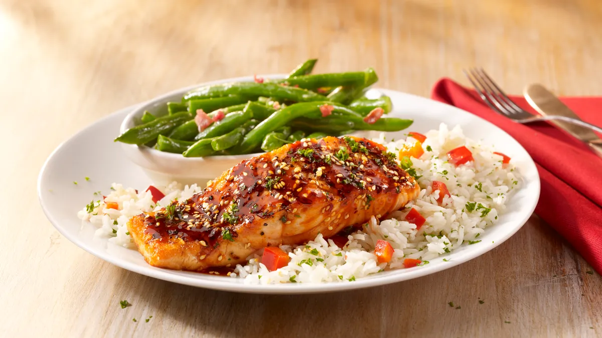 An image of a salmon dish from TGI Fridays' Grilled & Sauced menu.