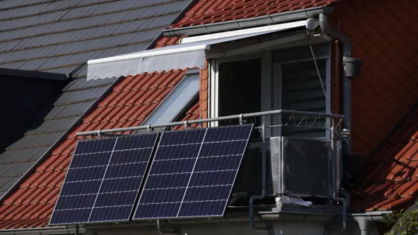 Solar panels attached to an apartment balcony