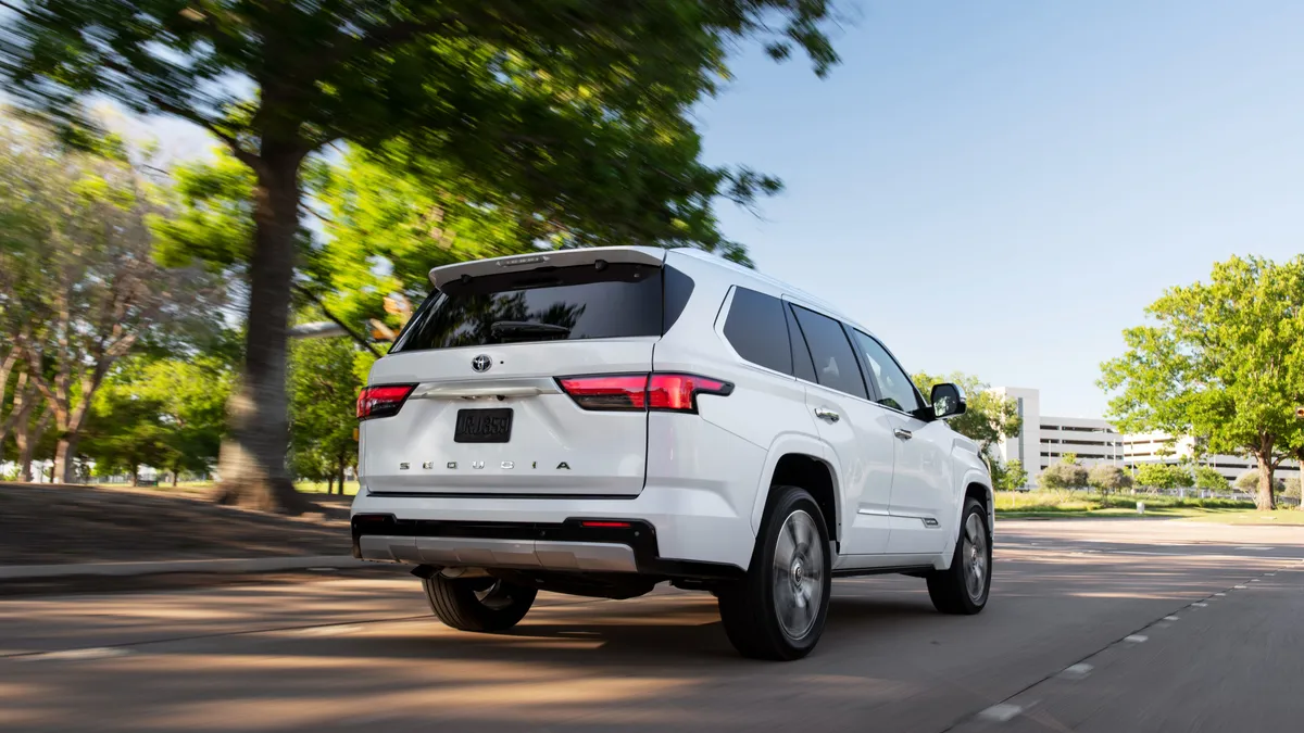 A white SUV on the road.