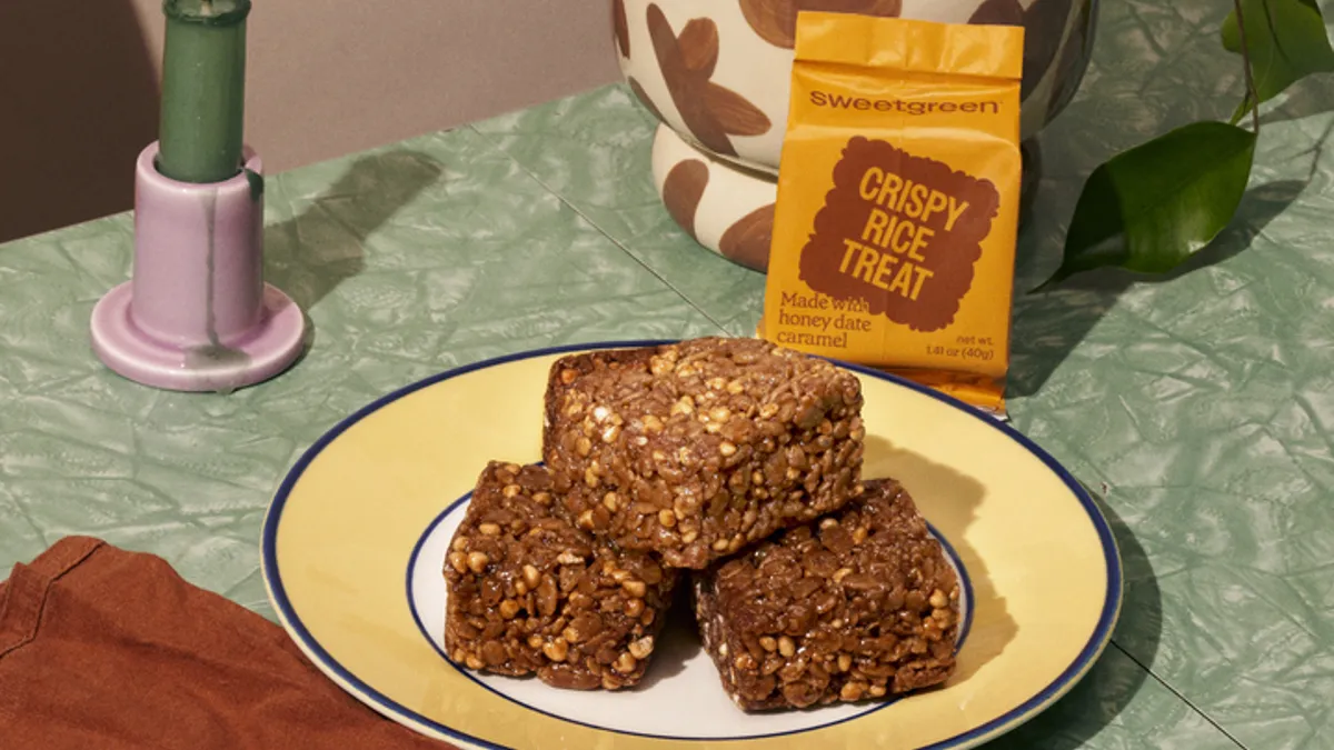 A picture of a brown crispy rice treat from Sweetgreen.