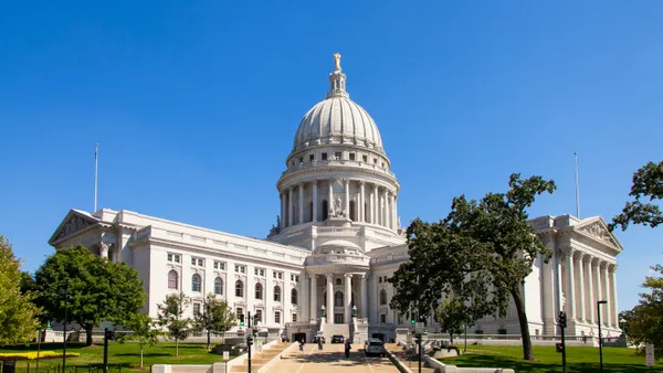 The exterior building of Wisconsin's state capitol on a sunny day.