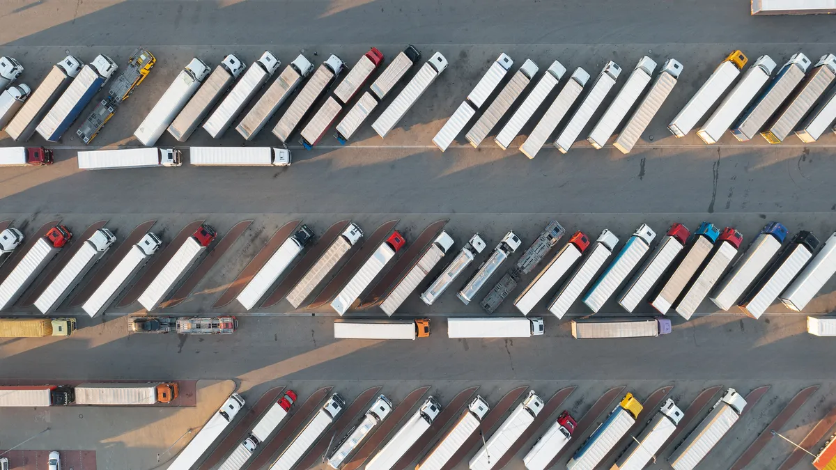 Aerial photo of trucks parked in a lot.