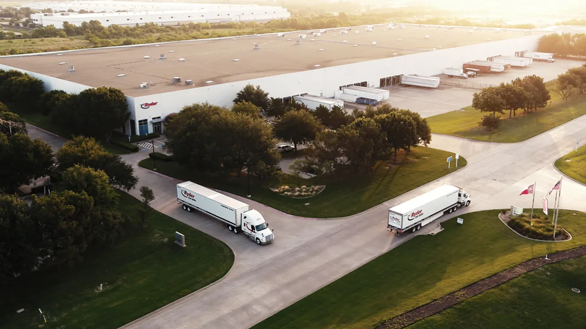 Ryder trucks outside a facility.