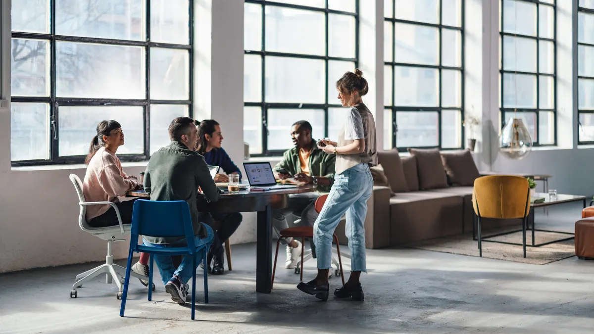 Professionals Collaborating in a Modern Co-Working Space