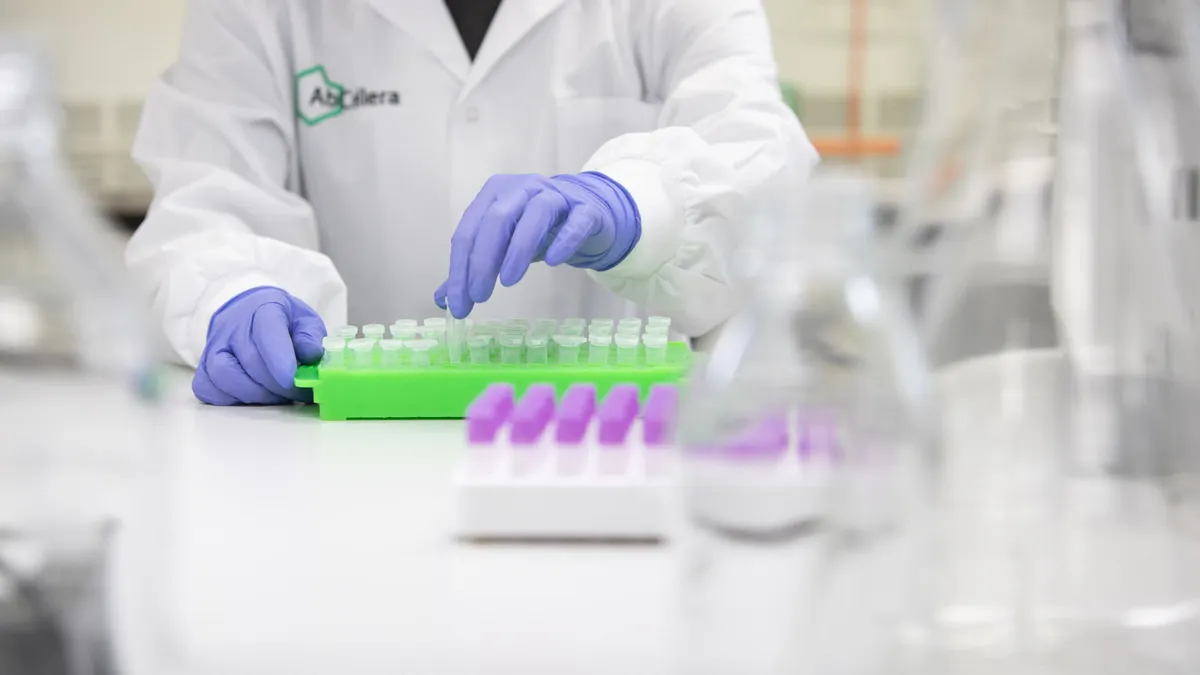 An AbCellera scientist preparing reagents for a molecular biology assay
