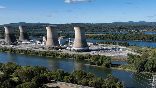 A nuclear power plant with transmission lines near a river.