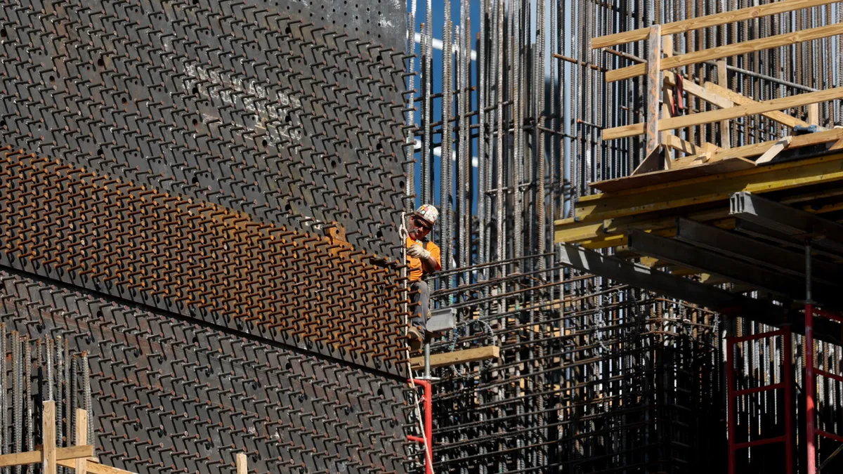 A construction worker helps build a condo tower using steel on Feb. 10, 2025, in Miami, Fla.