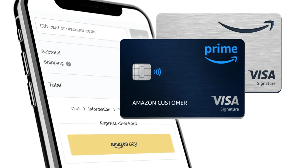 Two Amazon-branded credit cards in front of the Amazon checkout page displayed on a mobile phone.