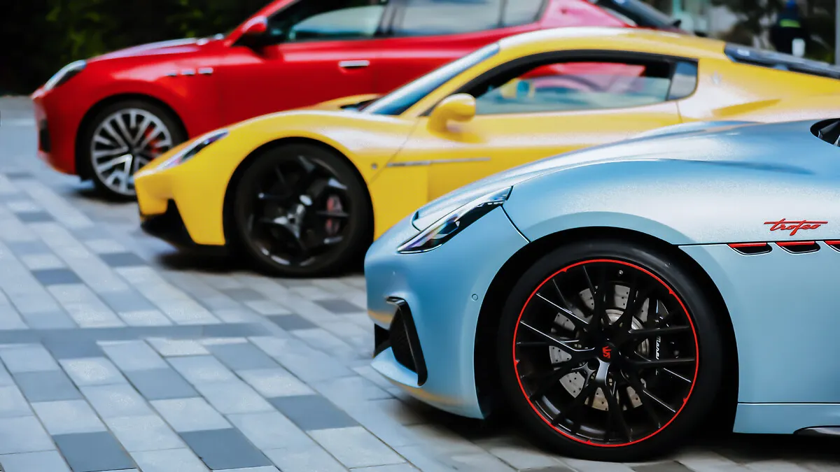 Maserati models lined up together in celebration of the brand's 110th birthday