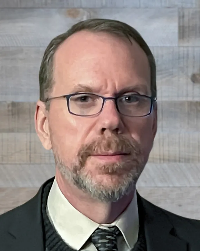 A headshot of Jim Barrett