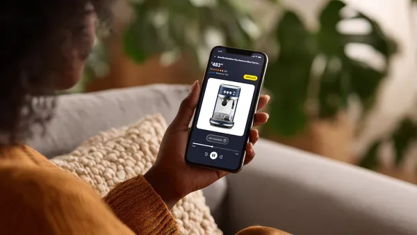 A person holding a smartphone featuring Amazon join the chat.