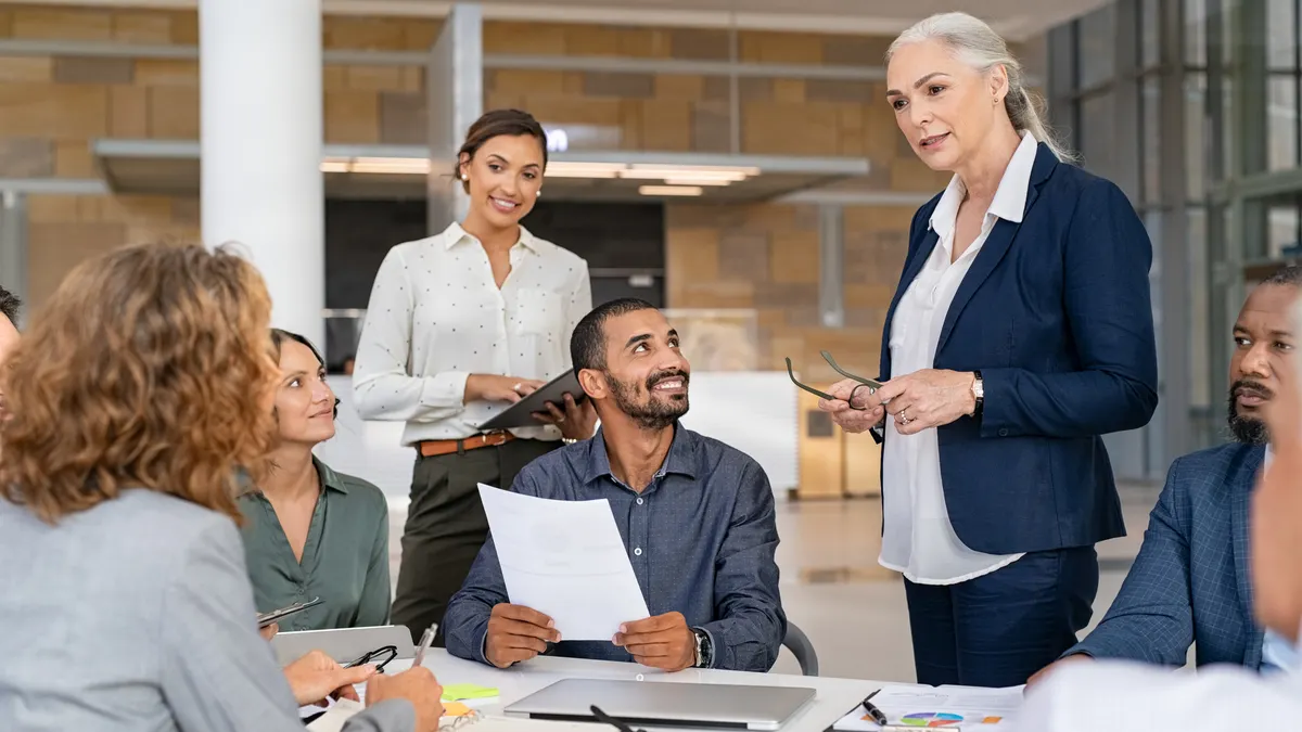 Multiethnic business team in meeting at modern board room
