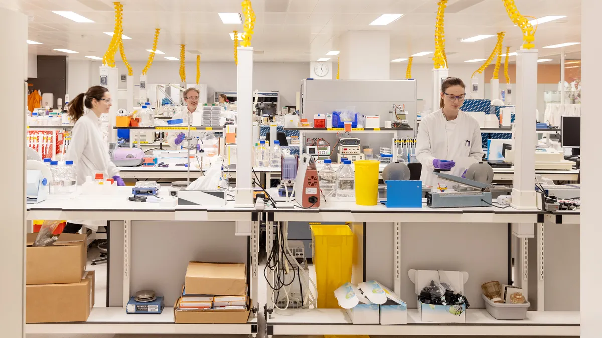 A photo of GSK employees at a research laboratory.