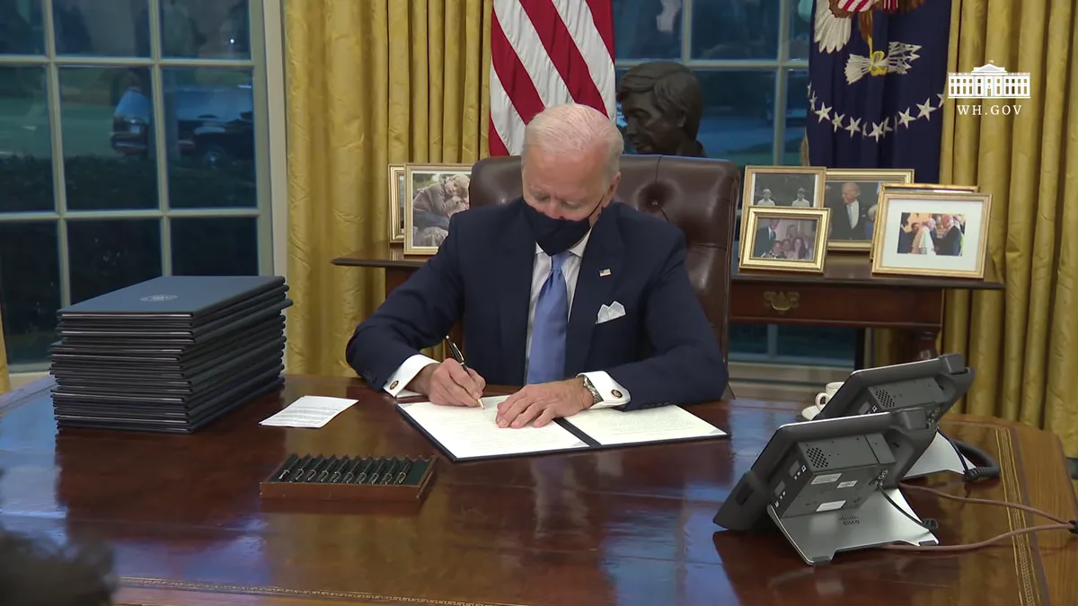 Joe Biden signs executive orders on his first day as president